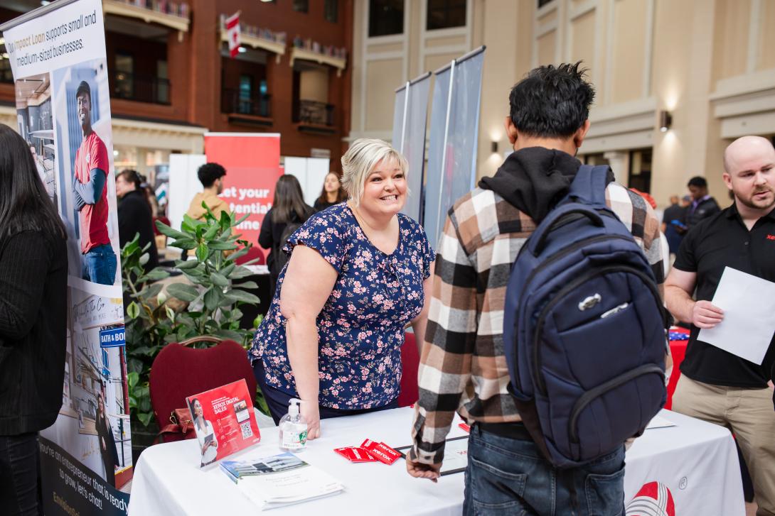 People interacting at a job fair