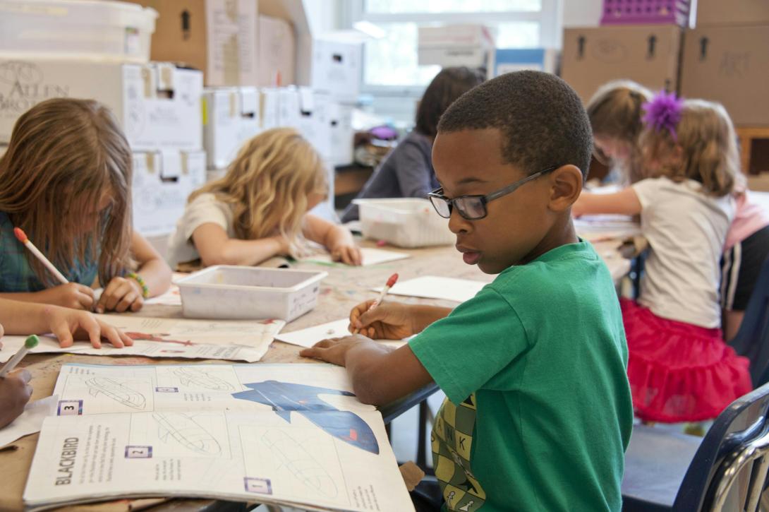 Child working on homework in the classroom