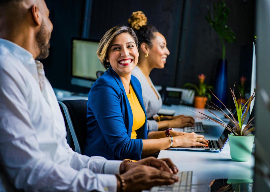 Someone smiling at their computer